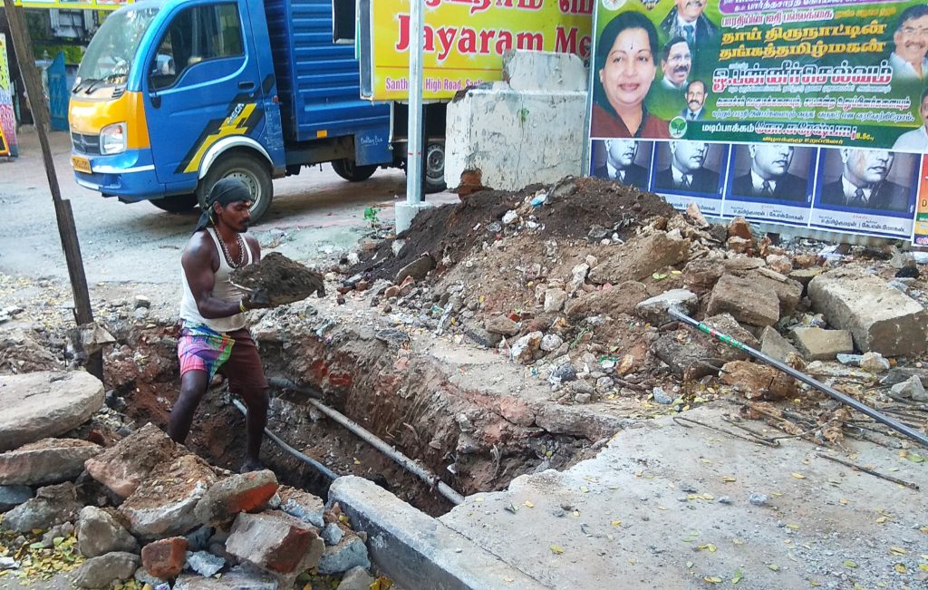 MYLAPORE TIMES - Civic workers de-silt drains on San Thome High Road